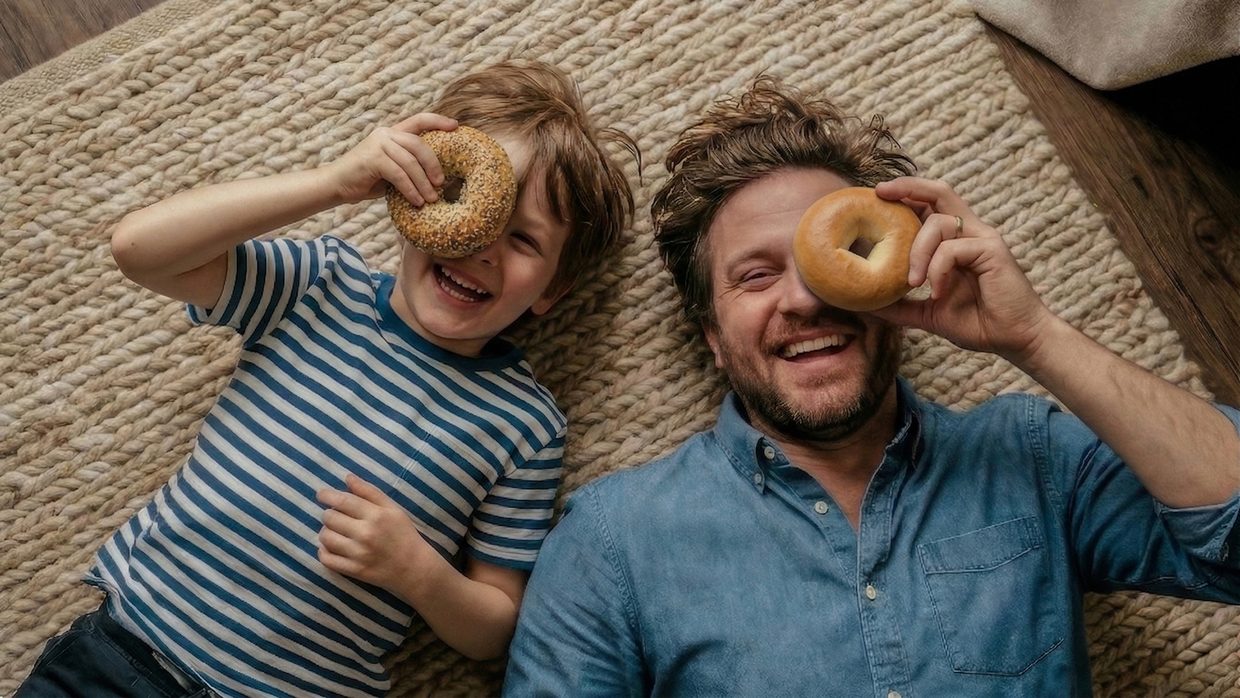 Father and child at home with Bimbo bagels