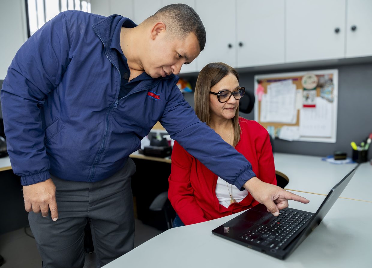 A Bimbo supervisor and associate reviewing a development plan
